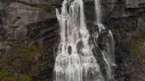 Aerial pullback from big waterfall revealing hanging valley in autumn Stock Footage 147028342