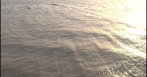 Aerial Pullback from Buoy Revealing Wide Suffolk Sea Stock-Footage 320182309