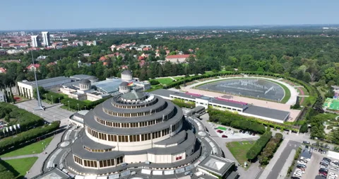 Aerial pullback from Centennial Hall in Wrocław on a sunny summer day Stock Footage 346655890