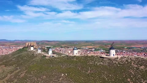 Aerial Pullback from Consuegra Windmills Revealing Historic Town Stock Footage 331880920