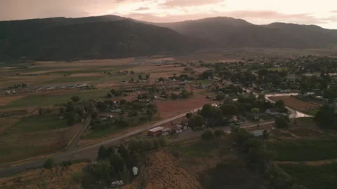 Aerial-Pullback-Darkening small town after rain at sunset Stock Footage 204830448