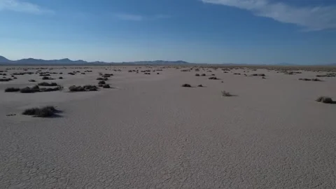 Aerial pullback of a desolate dry lake in the New Mexico desert Stock Footage 199105444