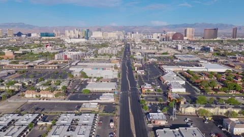 Aerial pullback drone view of Las Vegas suburbs and city skyline and streets Stock Footage 333487809