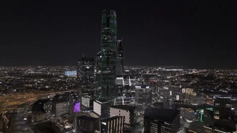 Aerial Pullback Establishing Shot of KAFD Skyline at Night in Riyadh Stock Footage 345046163