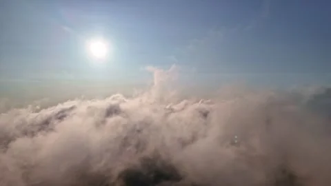Aerial Pullback Flying Above Cloud Layer Sun Blue Sky Breathtaking Cloudscape Stock Footage 334693217