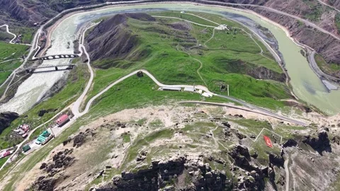 Aerial Pullback From Giant Castle Revealing River and Historic Sites Stock Footage 344792850