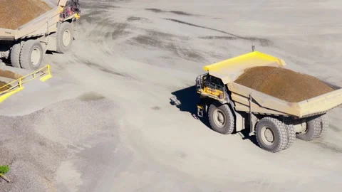 Aerial Pullback of Loaded Haul Truck on Quarry Floor Stock Footage 331597050