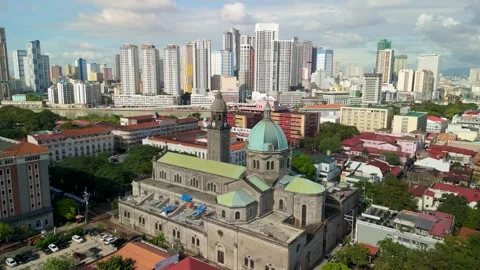 Aerial pullback from Manila Cathedral revealing Intramuros district and city Video stock 333784700