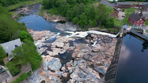 Aerial pullback of natural geologic formation of Shelburne Falls Potholes Stock Footage 277619929
