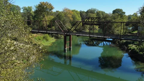 Aerial Pullback of Old River and Railroad Bridge in Benton Stock Footage 331425789