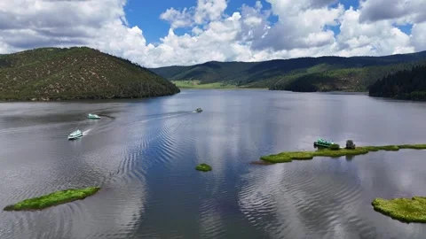 Aerial Pullback Over Alpine Lake and Islets in Potatso National Park Stock Footage 331975718