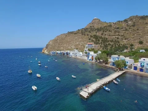 AERIAL Pullback over boats and peopel on a Pier in the Mediterranean Видео 76994262