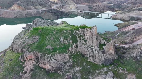 Aerial Pullback Over Castle, River and Bridge at Sunset Stock Footage 345634286