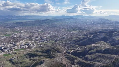Aerial Pullback Over City Under Dramatic Daytime Clouds Stock Footage 344728343