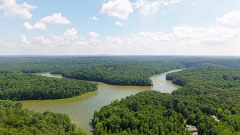 Aerial Pullback Over Lake Allatoona with Boat and Forested Shoreline in Georgia Stock Footage 344914747
