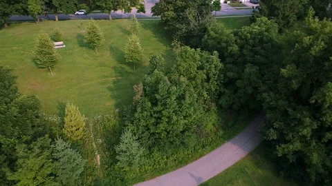 Aerial Pullback Over a Park Hill and Pathway Stock-Footage 347151217