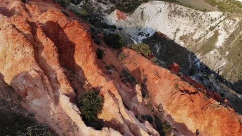 Aerial Pullback Over Red Rock Formation at Sunset Stock Footage 109428433