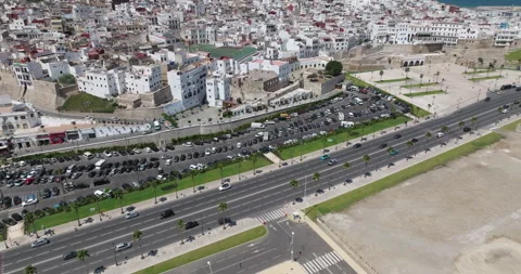 Aerial pullback over a Tangier waterfront basin and city roads Video stock 347840465