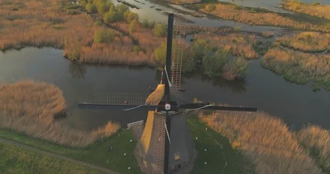 Aerial pullback over traditional windmill at Kinderdijk UNESCO World heritage Stock-Footage 108044784