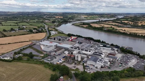 Aerial pullback overview of meat processing plant Grannagh Kilkenny with Thomas Stock Footage 345010269