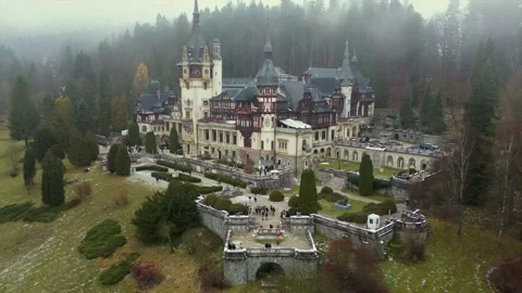 Aerial Pullback of Peles Castle and Carpathian Mountains in Romania Stock-Footage 331203457