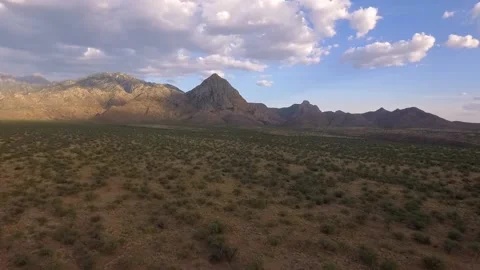Aerial pullback of a prominent desert mountain peak Stock Footage 130214029