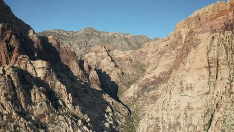 Aerial Pullback Reveal of Canyons and Mountains at Red Rock, Red Rock Canyons Stock Footage 116731230