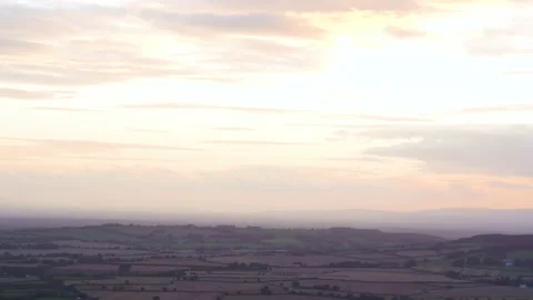 Aerial pullback reveal drone shot of large festival at sunset. Stock Footage 146794484