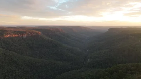 Aerial Pullback Reveal Over Canyon at Sunset, Bundanoon NSW Video stock 333937283