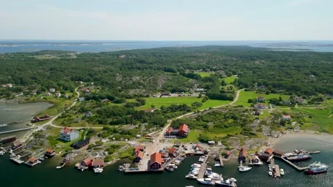 Aerial Pullback Reveal of Sydkoster Island Village Harbor and Ferry Sweden Stock-Footage 333784983