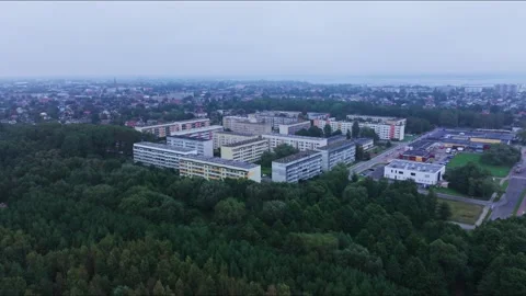 Aerial Pullback Reveals Liepaja Soviet Housing Surrounded By Forest Video stock 334332384