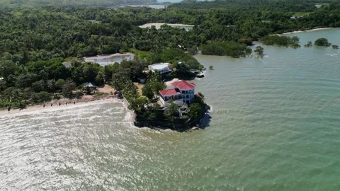 Aerial pullback of Roca Encantada coastal house, Guimaras Island, Philippines Stock Footage 332932558