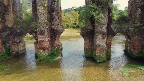 Aerial Pullback from Roman Nicopolis Aqueduct Arches over Louros River Stock Footage 331331967