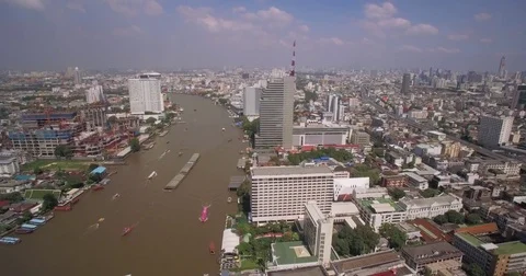 Aerial Pullback Shot Along Chao Phraya River-Bank in Bangkok, Thailand Stock Footage 73467750