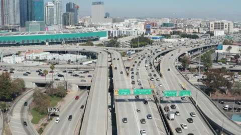 Aerial pullback shot of busy highway car traffic in downtown Los Angeles Stock Footage 273747359