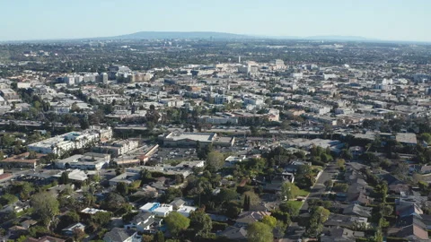 Aerial pullback shot of Culver City Los Angeleles with car highway traffic Stock Footage 272695243