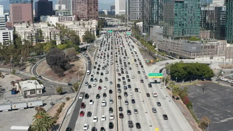 Aerial pullback shot of downtown Los Angeles busy, congested freeway traffic Stock Footage 273745486