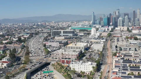 Aerial pullback shot of downtown Los Angeles buildings and skyscrapers and cars Stock Footage 273755454