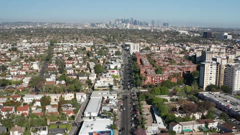 Aerial pullback shot of the energetic and busy Los Angeles urban neighborhood Stock Footage 272778687