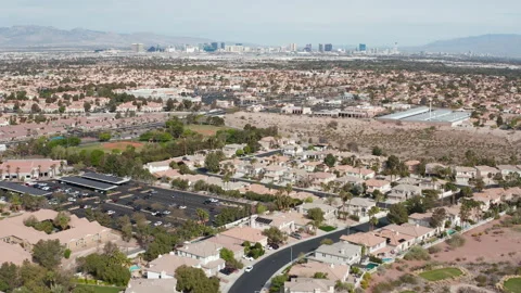 Aerial pullback shot of Henderson Las Vegas suburbs with Strip city skyline Stock Footage 271303102