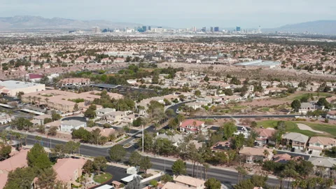 Aerial pullback shot of Henderson Las Vegas residential community and skyline Stock Footage 271303108