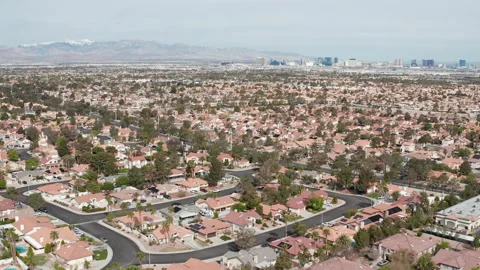Aerial pullback shot of Henderson Las Vegas suburban area with city skyline Stock Footage 271308049