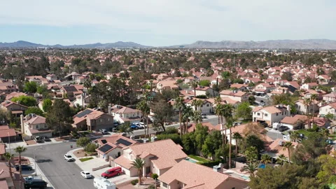 Aerial pullback shot of Henderson Las Vegas residence with many palm trees Stock Footage 271310396