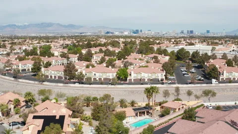 Aerial pullback shot of Henderson Las Vegas residential suburb with city skyline Stock Footage 271311168