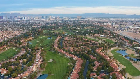 Aerial pullback shot of Las Vegas residential community, houses,  golf course Stock Footage 121816608