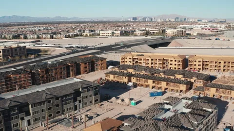 Aerial pullback shot of Las Vegas suburban housing construction and city skyline Stock Footage 271155522