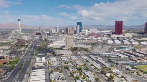 Aerial pullback shot of Las Vegas Strip hotels and city streets Stock Footage 333484084