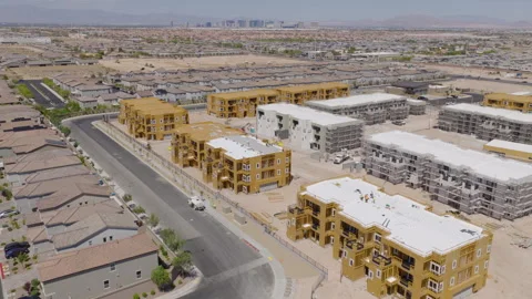 Aerial Pullback Shot of Las Vegas Residential Construction Site and City Skyline Stock Footage 333658904