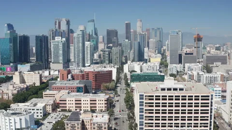 Aerial pullback shot of Los Angeles downtown commercial district and buildings Video stock 273749827