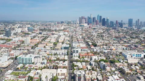 Aerial pullback shot of Los Angeles downtown Koreatown urban homes and buildings Stock Footage 308098211